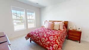 Primary bedroom featuring carpet flooring