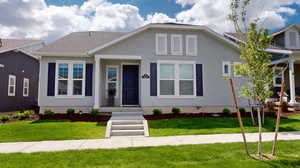 View of front of house with a front yard