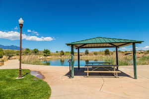 View of home's community featuring a gazebo and a water view