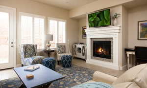 Living room featuring tile floors and a healthy amount of sunlight