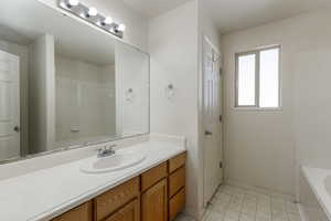 Bathroom with tile flooring and vanity