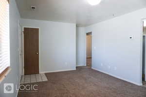 View of carpeted spare room