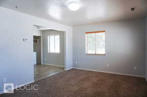 Spare room featuring tile floors