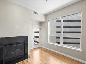 Unfurnished living room with light hardwood / wood-style floors