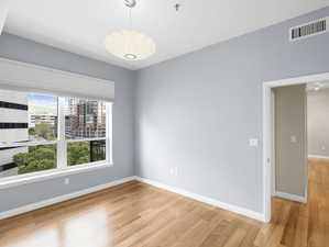 Empty room with light wood-type flooring