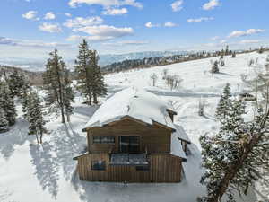 Snowy aerial view with a mountain view