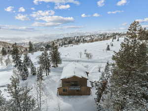 Snowy aerial view with a mountain view