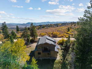 View of subject property with mountains