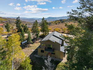 View of subject property with a mountain backdrop