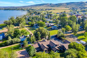 Drone / aerial view with a water and mountain view