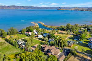 Drone / aerial view with a water and mountain view