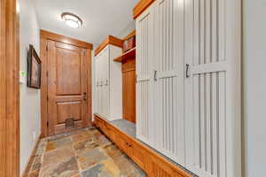 Mudroom featuring tile flooring