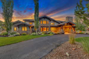 Craftsman inspired home featuring a lawn