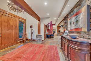 Tiled entrance foyer featuring an inviting chandelier