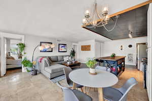 Dining room featuring an inviting chandelier and light tile floors