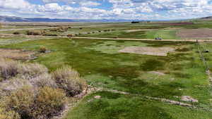 Birds eye view of property featuring a mountain view and a rural view