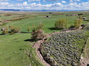 Drone / aerial view featuring a mountain view and a rural view