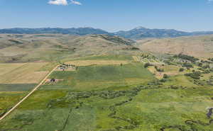 Drone / aerial view featuring a mountain view and a rural view