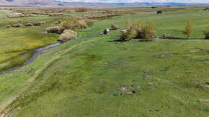 Drone / aerial view with a mountain view and a rural view