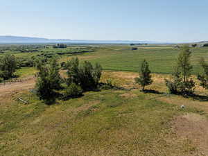 Birds eye view of property with a rural view