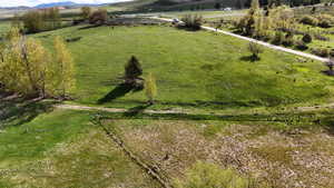 Birds eye view of property with a rural view