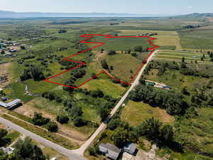 Birds eye view of property featuring a rural view