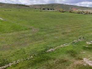 Aerial view featuring a rural view and a mountain view