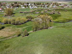 Birds eye view of property with a rural view