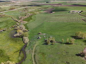 Birds eye view of property featuring a rural view