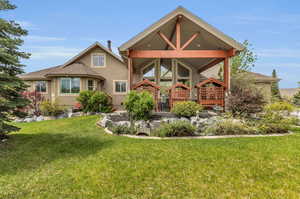 View of the backyard and awning of the house with back lawn