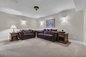 Living room featuring carpet or can be turned into a theater room