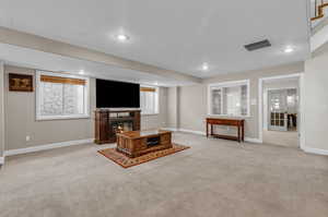 Living room with light colored carpet