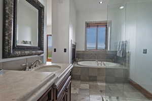 3rd Primary Suite Bath featuring vanity with extensive cabinet space, independent shower and bath, and tile floors