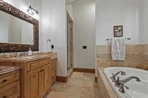 4th Bedroom Suite Bath featuring tile floors, independent shower and bath, and vanity