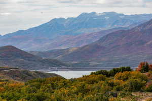 Property view of mountains with a water view