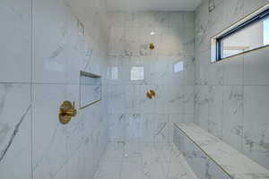 Bathroom with a tile shower