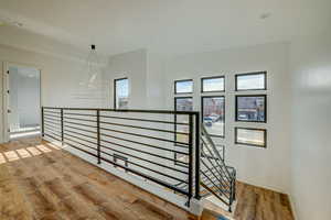 Hallway with light hardwood / wood-style floors