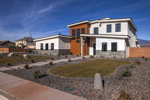 View of front of house with a front lawn