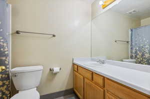 Bathroom featuring toilet and vanity