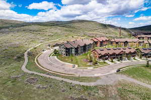 Birds eye view of property with a mountain view