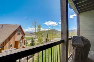 Balcony featuring a mountain view and a grill