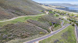 Aerial view featuring a water and mountain view