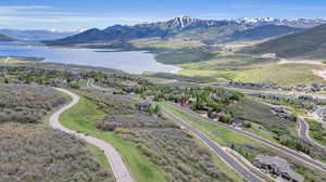 Drone / aerial view with a water and mountain view