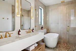 Bathroom featuring shower with separate bathtub, vanity, tile walls, and a healthy amount of sunlight