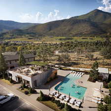 Birds eye view of property with a mountain view