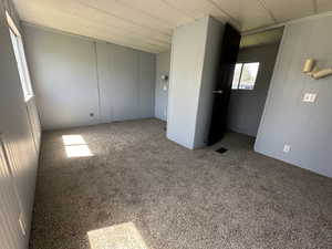 Unfurnished room with carpet floors