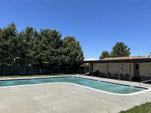 View of swimming pool with a patio area