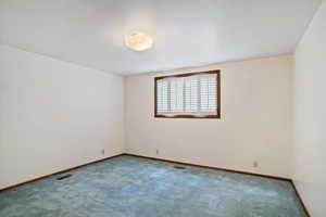 Empty room featuring carpet floors