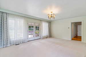 Unfurnished room with carpet.