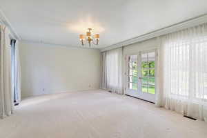 Bedroom featuring carpet flooring and french doors